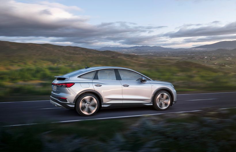 Skoda enyaq iV exterior side driving on country road
